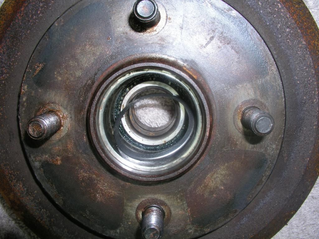 Rear wheel bearing failure? + Brake stuck ON + brake pads stuck onto